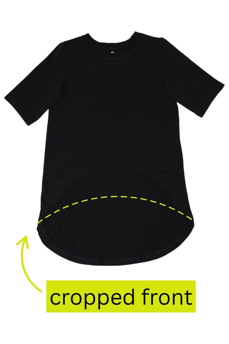 May include: A black t-shirt with short sleeves and a rounded, cropped front hemline. The text "cropped front" is displayed in a green rectangle below the shirt. The shirt is made of a soft, opaque fabric.