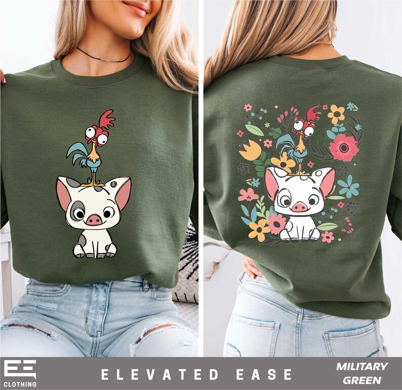 a woman wearing a green shirt with an image of a pig on it