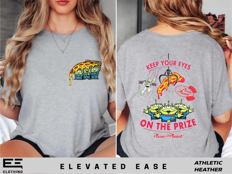 a woman wearing a grey shirt with a cartoon character on it