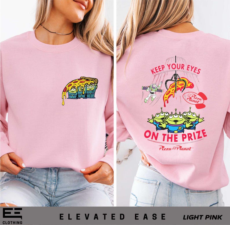 a woman wearing a pink sweatshirt with the words, keep your eyes on the prize