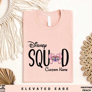 a pink tshirt with the disney squad name on it