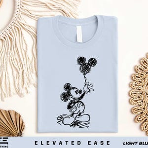 a t - shirt with a drawing of mickey mouse on it