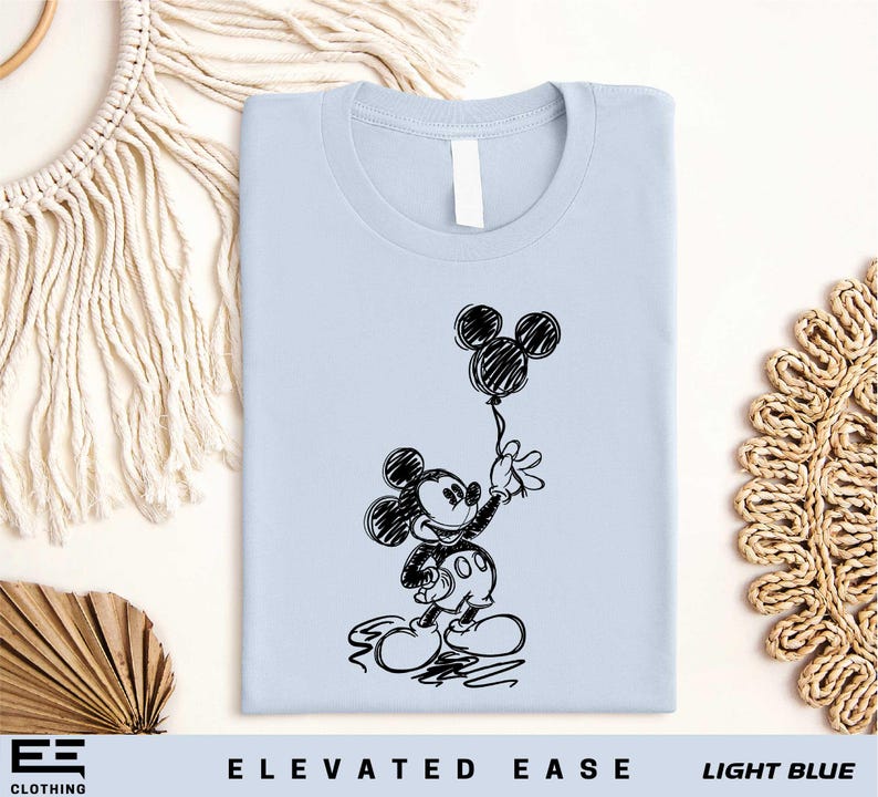 a t - shirt with a drawing of mickey mouse on it