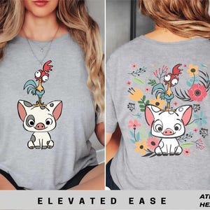 a woman wearing a t - shirt with an image of a pig and rooster on
