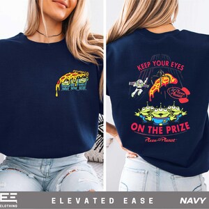 a woman wearing a t - shirt that says keep your eyes on the prize