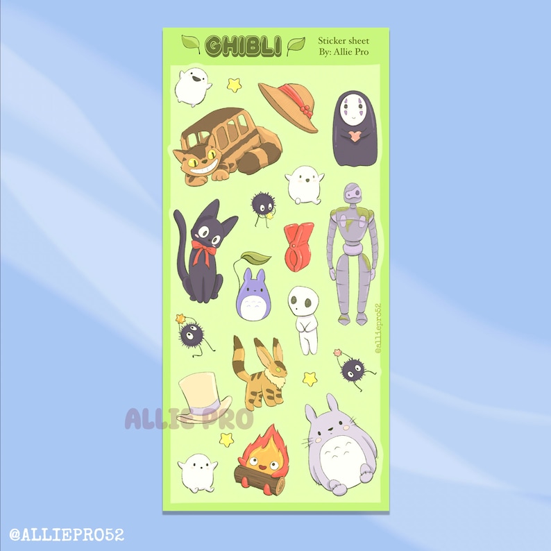 May include: A sticker sheet featuring various characters from Studio Ghibli films. The sheet includes images of Totoro, No-Face, Jiji the cat, and other iconic characters. The sheet has a green background with the word "GHIBLI" at the top.
