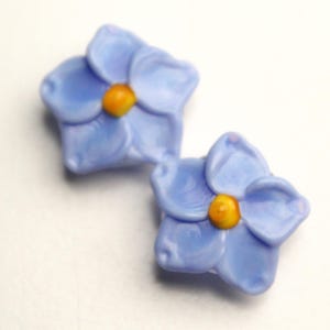 Forget Me Not Beads, pair of handmade artisan lampwork glass in light periwinkle blue and orange