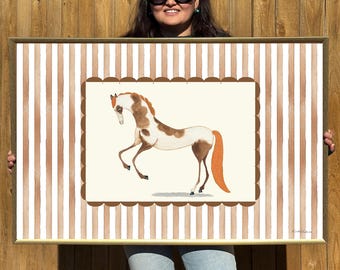 May include: A framed print of a watercolor painting of a brown and white horse with an orange tail, standing on a white background with a brown and white striped border.