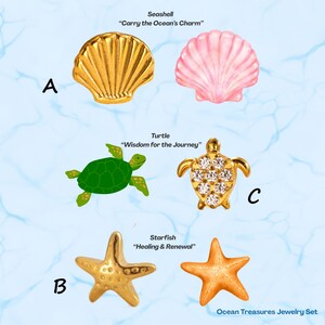 May include: An assortment of ocean-themed jewelry pieces, including a gold seashell, a pink seashell, a green turtle, a gold turtle with clear stones, and two starfish. The text reads "Carry the Ocean's Charm", "Wisdom for the Journey", and "Healing & Renewal".