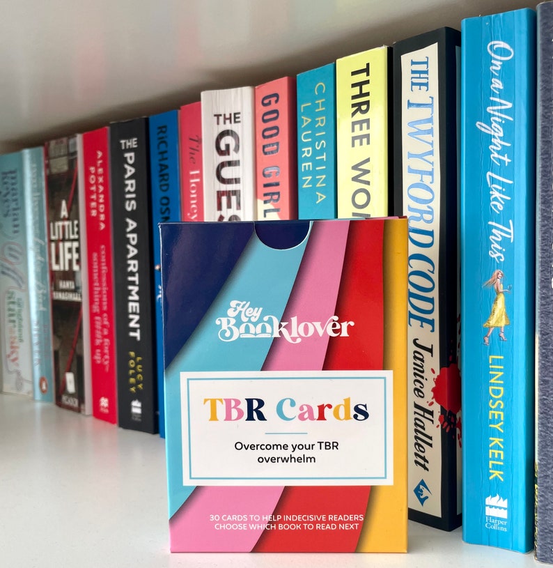 May include: A set of 30 TBR Cards to help indecisive readers choose which book to read next. The cards are blue, pink, and red with the text "Hey Booklover TBR Cards Overcome your TBR overwhelm".