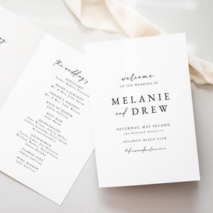 May include: Wedding ceremony programme with a white background and black text. The programme lists the order of events for the ceremony and the wedding party. The text includes the names of the officiant, bride's parents, groom's parents, maid of honour, best man, bridesmaids, groomsmen, flower girl, and ring bearer. The programme also includes the date and location of the wedding. The hashtag #drewandmelanie is at the bottom of the programme.