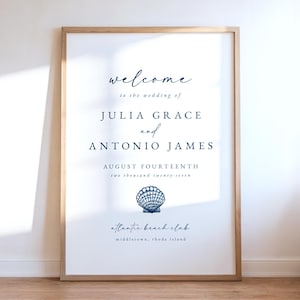 Puede incluir: Un letrero de bienvenida de boda enmarcado con una escritura elegante. El letrero dice "welcome to the wedding of JULIA GRACE and ANTONIO JAMES, AUGUST FOURTEENTH two thousand twenty-seven." Un gráfico de concha está en la parte inferior, con "atlantic beach club, middletown, rhode island."