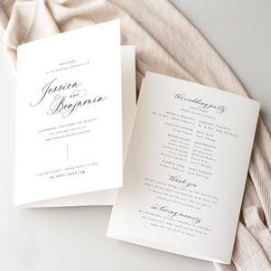 May include: Two white wedding programs with elegant calligraphy. The left program welcomes guests to Jessica and Benjamin's wedding on August 1st in Providence. The right program lists the wedding party and includes a thank you message.