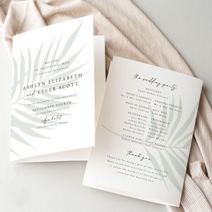 May include: Wedding program with a tropical leaf design. The program includes the names of the bride and groom, the officiant, the wedding party, and a thank you message.
