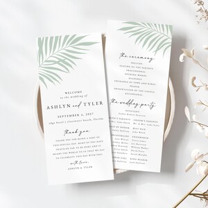 May include: Wedding ceremony programs with a palm leaf design in light green. The programs include the names Ashlyn and Tyler, the date September 4, 2027, and the ceremony details. The programs are on a white background.