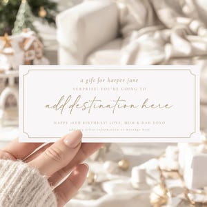 May include: A cream-coloured gift certificate with gold text and a decorative border. The text reads "a gift for harper jane", "SURPRISE! YOU'RE GOING TO add destination here", and "HAPPY 18TH BIRTHDAY! LOVE, MOM & DAD XOXO".