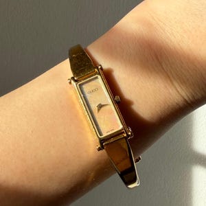 GUCCI 1500L ゴールド Exc+3] Gucci 1500L Watch Ladies Rectangle Champagne Quartz Gold