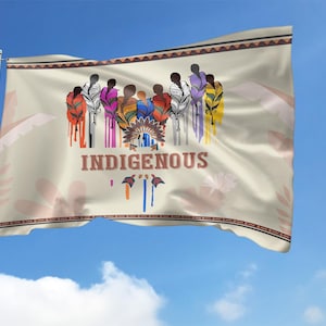May include: A beige flag with a colorful illustration of people standing together. The text "INDIGENOUS" is printed in brown letters on the flag.