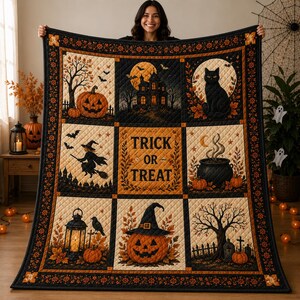 May include: A quilted throw blanket featuring a grid of nine panels with Halloween imagery including a jack-o'-lantern, a haunted house, a black cat, a witch, a cauldron, a lantern, and a central panel with the text TRICK OR TREAT.