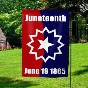 May include: A red, white, and blue garden flag with the words "Juneteenth" and "June 19 1865". The flag features a white star in a blue circle with a red background.