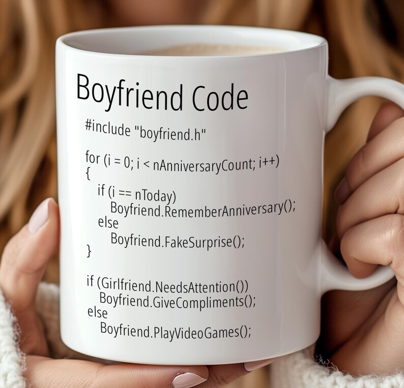 May include: White ceramic mug with a black design that reads "Boyfriend Code" and includes a humorous code snippet. The code includes the lines "#include "boyfriend.h"" and "Boyfriend.RememberAnniversary();".