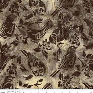May include: Fabric with a repeating pattern of birds and floral elements in shades of brown and cream. The design features stylized birds perched among leaves and flowers, creating a nature-inspired aesthetic. The fabric is suitable for various sewing projects.