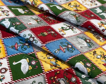 May include: A fabric featuring a repeating grid pattern of squares in red, green, blue, yellow, and white. Each square contains illustrations of birds, dancers, and numbered circular motifs, separated by thin red and white striped borders.