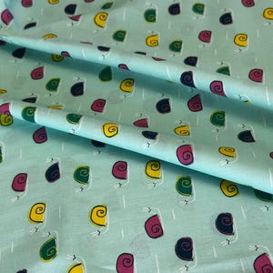 Colorful Snails on Mint Green Fabric – Whimsical Pink, Yellow & Green Spiral Shell Snails – Modern Cotton Quilting Fabric by the Yard