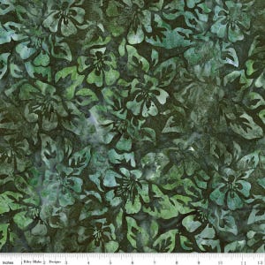 May include: Fabric with a floral pattern in shades of green and teal. The design features stylized flowers and leaves, creating a textured, batik-like appearance. The fabric is marked with inches and the text "Riley Blake Designs".