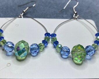 Iridescent light green and blue dangle crystal earrings