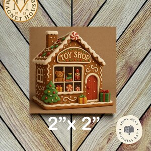 May include: A gingerbread house magnet, 2" x 2", with the text "TOY SHOP" above the window. The house is decorated with white icing, red and green accents, and a red door. A Christmas tree and wrapped gifts are also visible.
