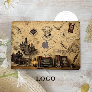 May include: A laptop skin featuring a vintage-style map of Hogwarts with a central crest, a steam train, a castle, and a stack of books. The design includes illustrations of an owl, a stag, a lantern, a quill, and the text Platform 9 3/4.