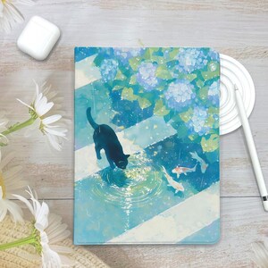 May include: A tablet case with a watercolour illustration of a black cat, koi carp, and blue hydrangeas in a rain scene. The design has a blue and white striped pattern, creating a serene aesthetic. The case is a protective accessory for tablets.