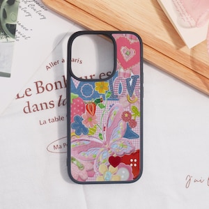 May include: A white ceramic mug with a black handle and the text "But First, Coffee" in a black, bold font. The mug is on a white surface.