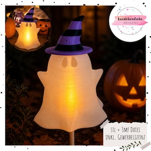 May include: A white ghost-shaped light fixture featuring a purple and black striped witch hat with a star detail. The ghost emits a warm orange glow from within and is mounted on a wooden stick. The text reads STL + 3MF DATEI INKL. GEWERBELIZENZ.