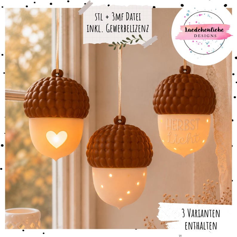 May include: Three hanging acorn-shaped ornaments with brown textured caps and glowing white bases. One base features a heart cutout, one has small light-emitting dots, and one displays the German text "HERBST Licht". Each hangs from a ribbon.