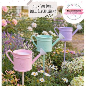 May include: Three pastel-coloured metal watering can garden stakes. The stakes are pink, mint green, and lavender, each with a heart detail. The image includes the text "STL + 3MF DATEI INKL. GEWERBELIZENZ" and a logo that says "Laedchenliebe DESIGNS".