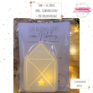 Könnte beinhalten: Eine leuchtende Umschlaglampe mit Stern, verpackt mit einer Karte mit der Aufschrift "EIN KLEINES LICHT vom Nikolaus". Das Produkt befindet sich in einer transparenten Plastiktüte. Zusätzlicher Text enthält "3MF + STL DATEI" und "3 VERSCHIEDENE MOTIV".
