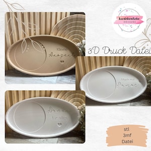 May include: Three white oval-shaped trays with different engraved text. The trays are made of a smooth, white material. The text on the trays reads "Kleine Auszeit", "Mach mal Pause", and "Danke für alles".