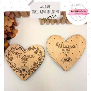 May include: Two wooden heart-shaped decorations. One is decorated with a floral wreath and the word "Mama" and "Du bist mein... Halt". The other heart has the word "Mama" and "Du bist mein... Anker". The text "SVG DATEI INKL. GEWERBELIZENZ" is also visible.