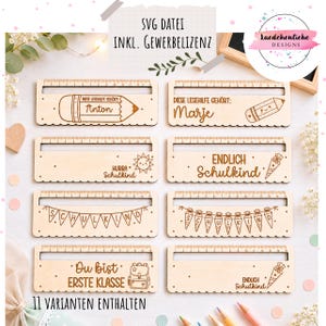 May include: Eleven wooden reading rulers with engraved designs and text are displayed. Each ruler has a measurement scale and school-themed illustrations, such as pencils, a sun, and a backpack. The text includes phrases like "Anton", "Marje", and "First Class".
