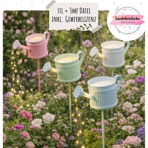May include: Four pastel-coloured watering can garden lights, including pink, green, and blue. Each can has a string of small lights cascading down. The background is a garden with flowers. Text on the image reads "STL + 3MF DATEI INKL. GEWERBELIZENZ".