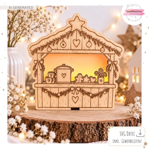 May include: A laser-cut wooden Christmas market stall decoration featuring a warm glowing interior. The front panel displays engraved motifs of a pot, mugs, gingerbread cookies, and hearts, accented with pine boughs and bows.
