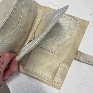 Sustainable. Ethically sourced horse leather. hand sewn. raw edge. silver zip detail. wallet. Rustic. Wabi sabi.