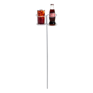 May include: A metal drink holder with a glass of cola and a Coca-Cola bottle. The glass is filled with ice and cola. The bottle has a red and white Coca-Cola label. The holder is silver and has a long, thin pole.