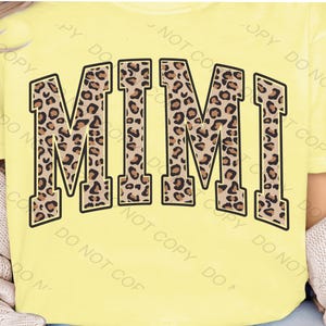 May include: A yellow t-shirt with the word "MIMI" printed in black outlined letters. The letters are filled with a leopard print pattern.
