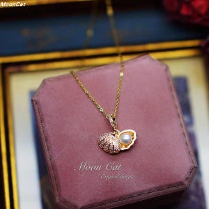Medaillonketting zeemeermin schelp – natuurlijke parel en zirkoon, 18 kt verguld