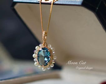 Handcrafted Ice Blue Crystal Pendant Necklace: Pearl & Gold-Plated Chain