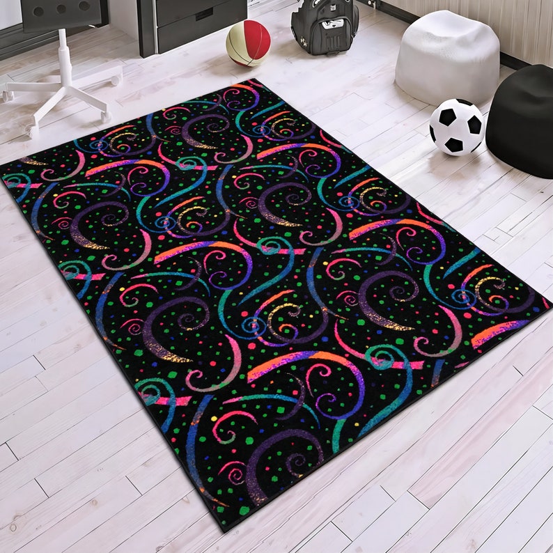 May include: A black area rug with a colorful swirl pattern. The swirls are in shades of pink, purple, green, blue, and orange. The background is black with small white dots.