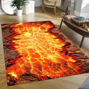 May include: A rectangular rug with a realistic image of a fiery orange and yellow lava flow. The lava is flowing through a crack in the ground, which is made of brown and gray rock.